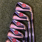 Set of golf clubs on a green grass background